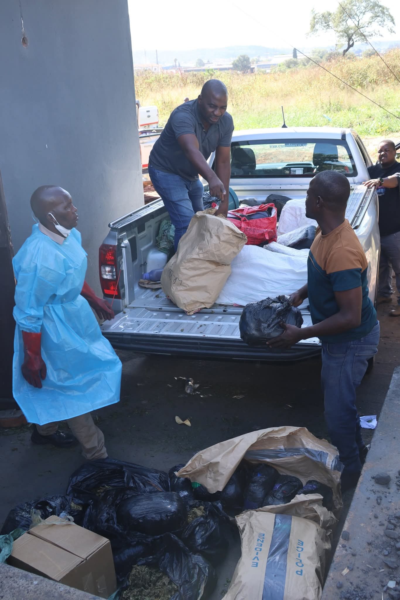 ZRP officers overseeing the destruction of illicit substances in Harare.