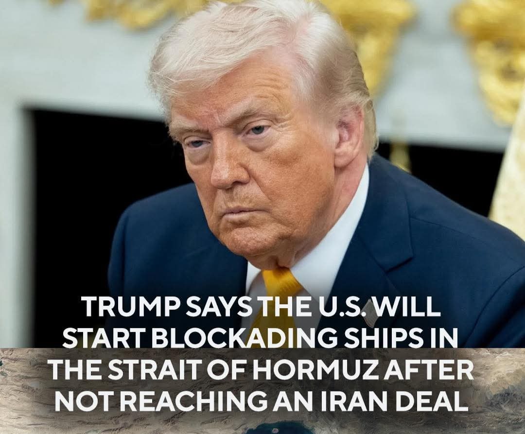 U.S. Navy warship near an oil tanker lane in the Strait of Hormuz with coastlines in the background