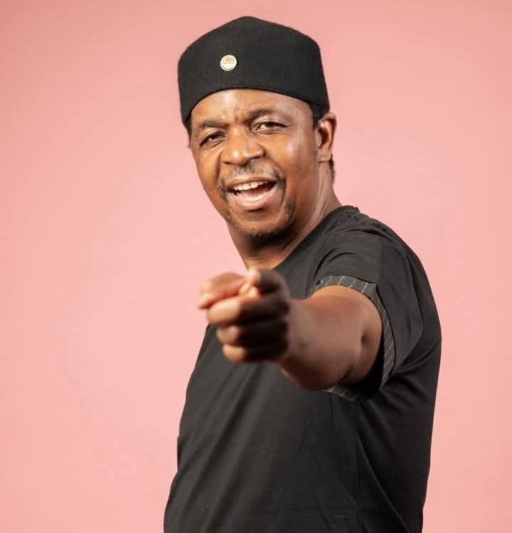 DJ Oskido (Oscar Mdlongwa) at a public event, identity dispute headline backdrop